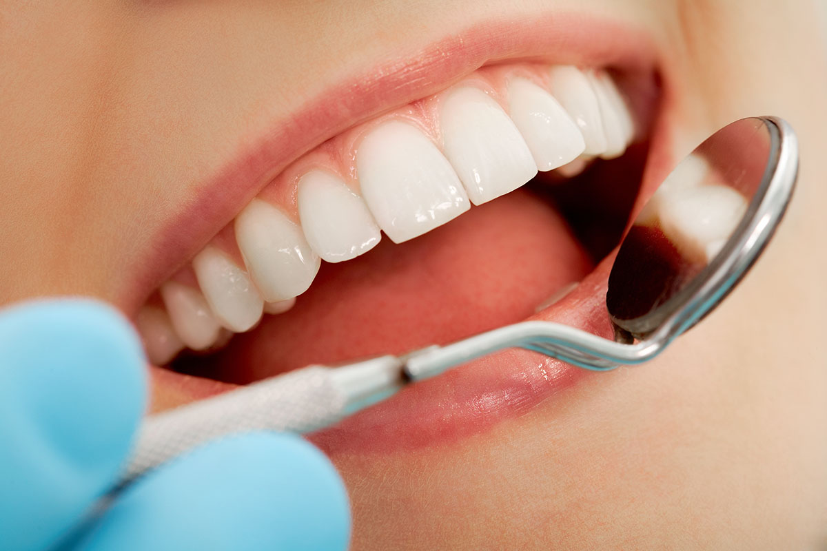 dentist checking a patient's smile